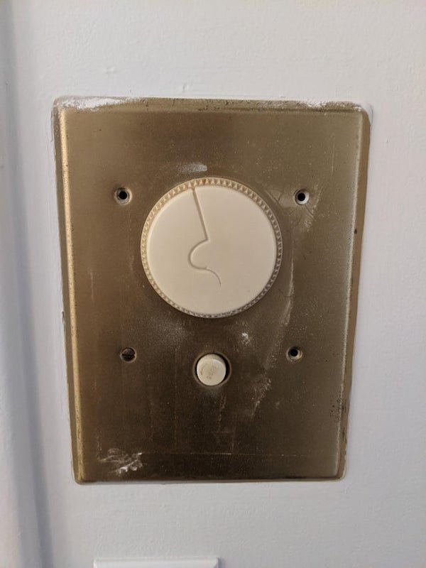What does this wall switch with circle dial and fuse do? Found in 1950s house.

A: I have something similar in my house built in the 1950’s and the dial would select the circuit and the button on the bottom would turn the circuit on and off. In my case it could control 80% of the lights in my house. They took the wiring down from 110-120v to 24v and used tones of small wires. You probably have some relay boxes in a closet somewhere unless the house was rewired.