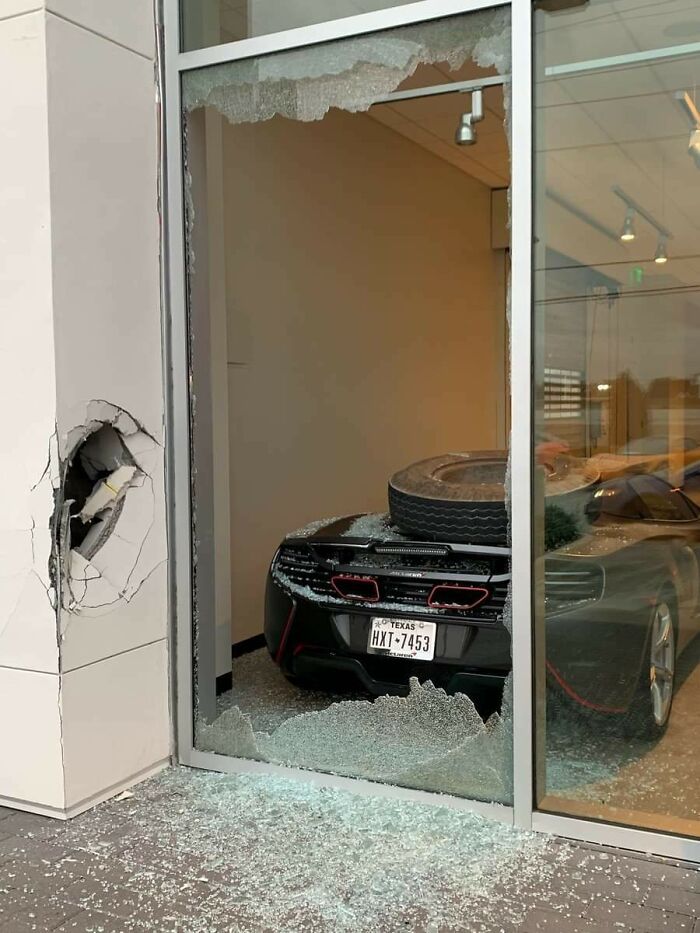 Mclaren Inside A Dealership Gets Hit By A Loose Truck Wheel