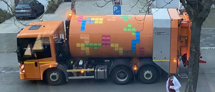 “These Tetris tiles on the rotating drum of a garbage truck.”