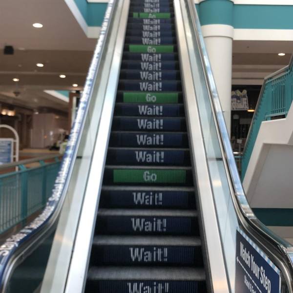 “Social distancing escalator at local mall.”