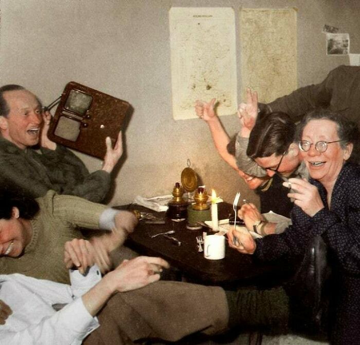 dutch resistance members celebrate at the moment they heard of adolf hitler's death over the radio may 1945