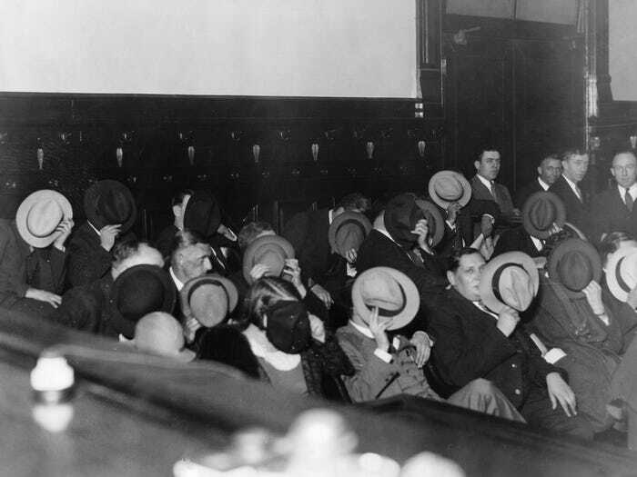 mobsters hide their faces at al capone's trial
