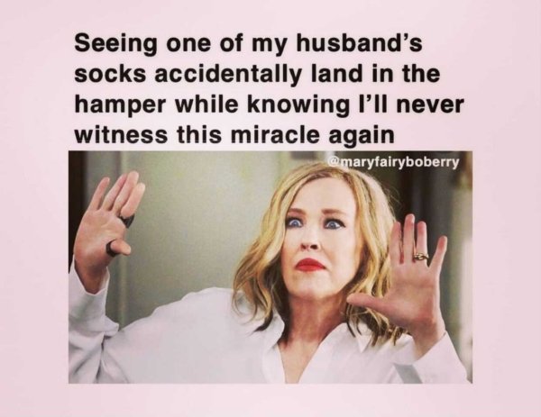 photo caption - Seeing one of my husband's socks accidentally land in the hamper while knowing I'll never witness this miracle again