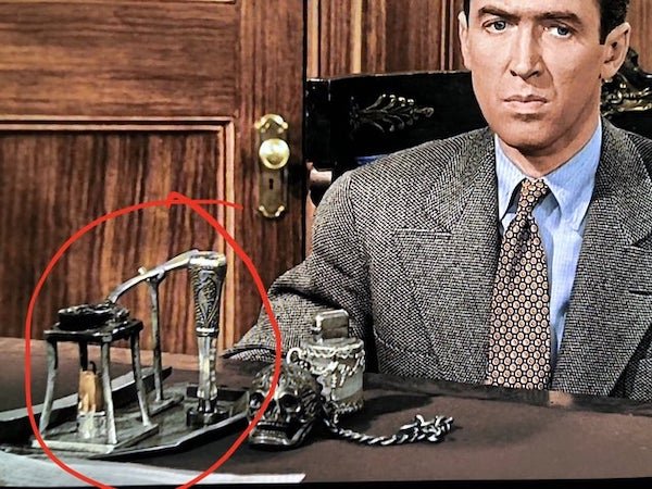 In It’s A Wonderful Life, what is this thing on Potter’s desk? (circled)

A: It looks like a wax stamp set up.