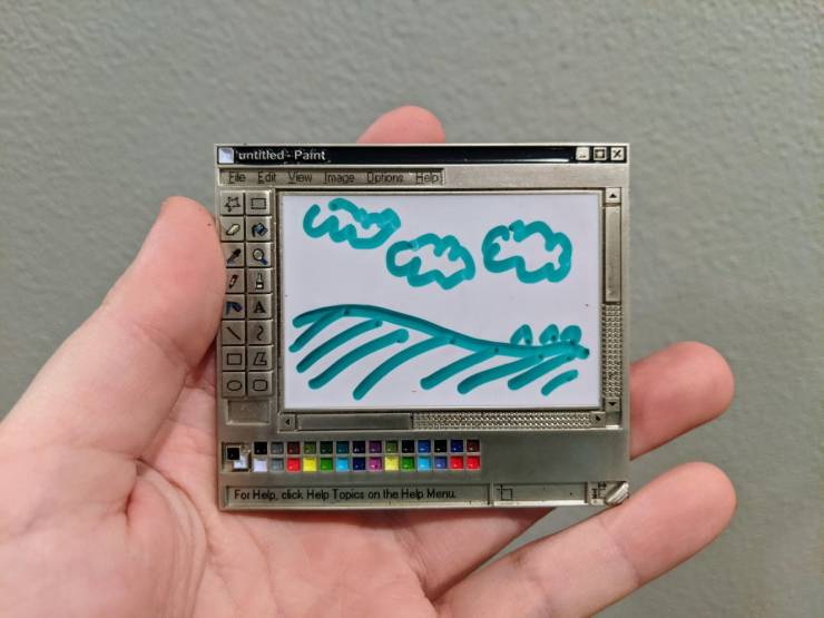 “An enamel pin with functional whiteboard that looks like the Windows 95 version of Paint.”