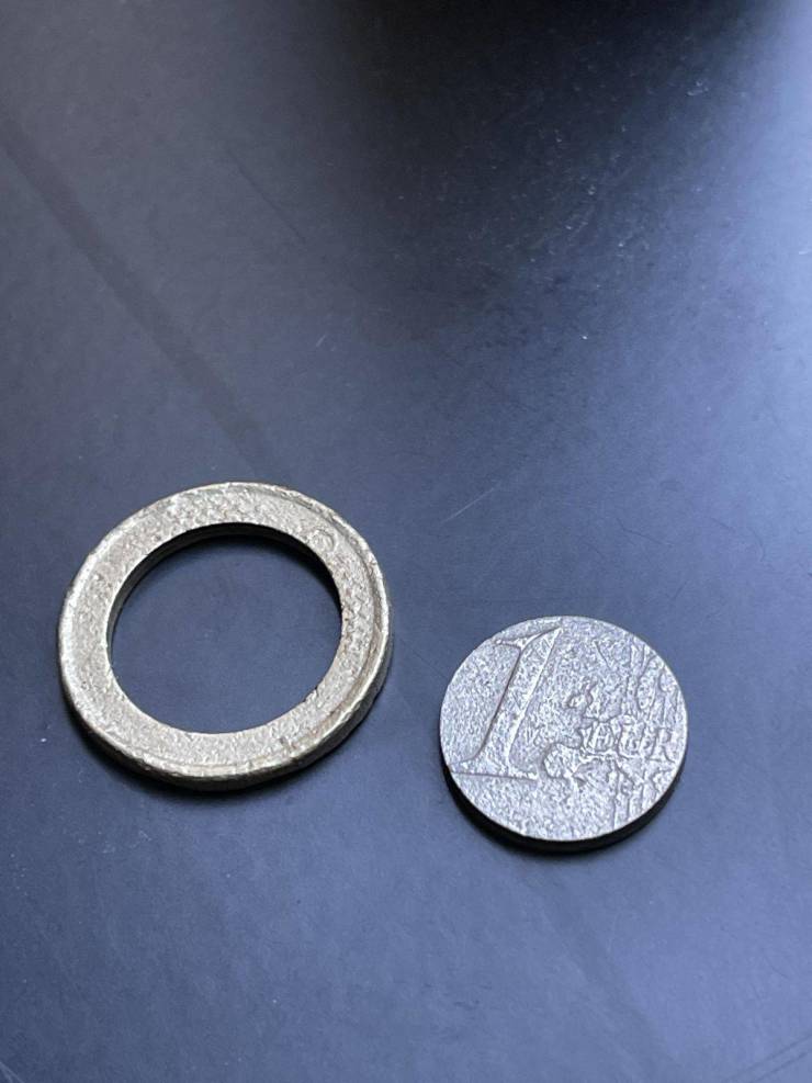 “One euro coin with inside seperated.”