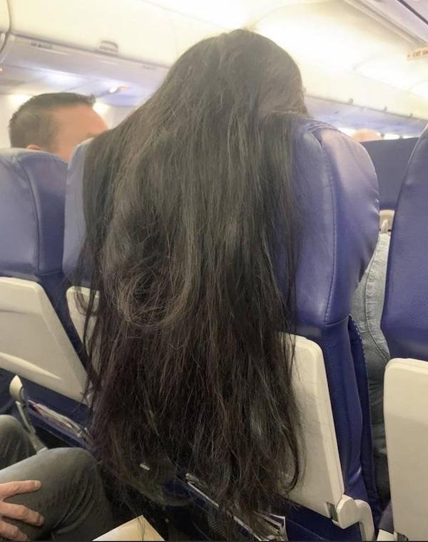 long hair draping over chair