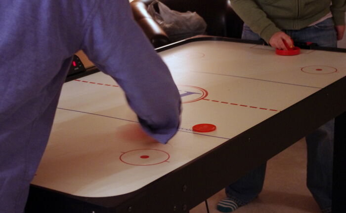 My family used to go to this campground in the summer and rent a little cabin for like a week. In the main building there was a little arcade - mostly older games, and a foosball table, and an air hockey table.

What most people didn't know was - the air hockey table was broke. If you put quarters in, you could push the plunger to start the machine and then get your quarters back if you did it juuuust right.

A couple of years in a row were SUPER fun because me and one other kid that knew would keep air hockey going for the entire time. The arcade would be filled with kids who would often play other games while waiting their turn at air hockey. They must have found out after a few years though because one year we went back and it was fixed - the arcade was also a complete ghost town, and the campground made no money off it after that. That's when I fully realized and understood the concept of a "loss leader" at like 13 years old.