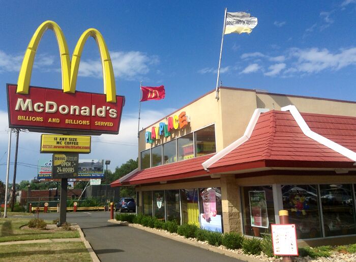 The McDonald's app used to have an entry in the order book for "garlic parmesan fries" that you only found through the search option. It cost $0.00. Every time I ordered it I got free regular fries.

Also you can set the drink option on happy meals to coffee, which is not really a loop hole but handy.