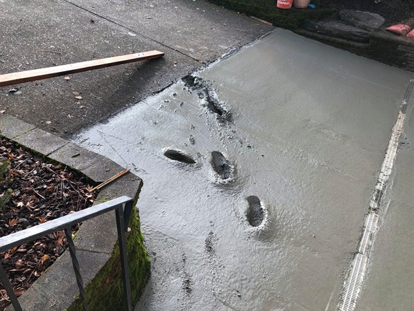 funny fail photos - wet cement with footprints