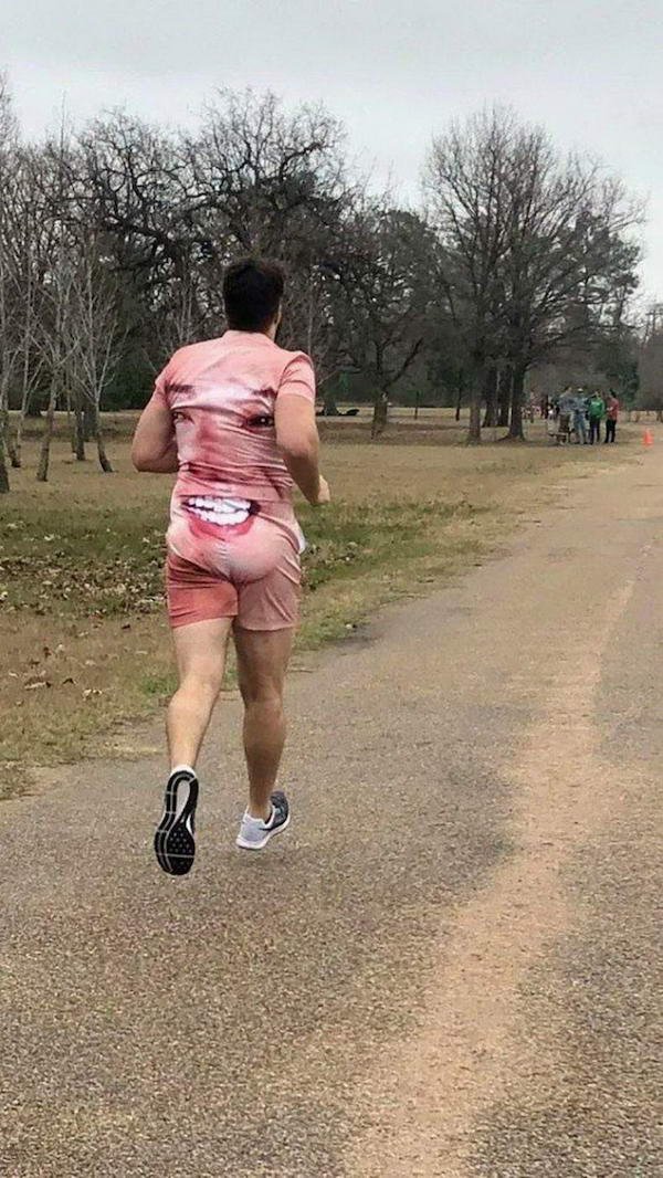 funny pictures - runner wearing disturbing face suit