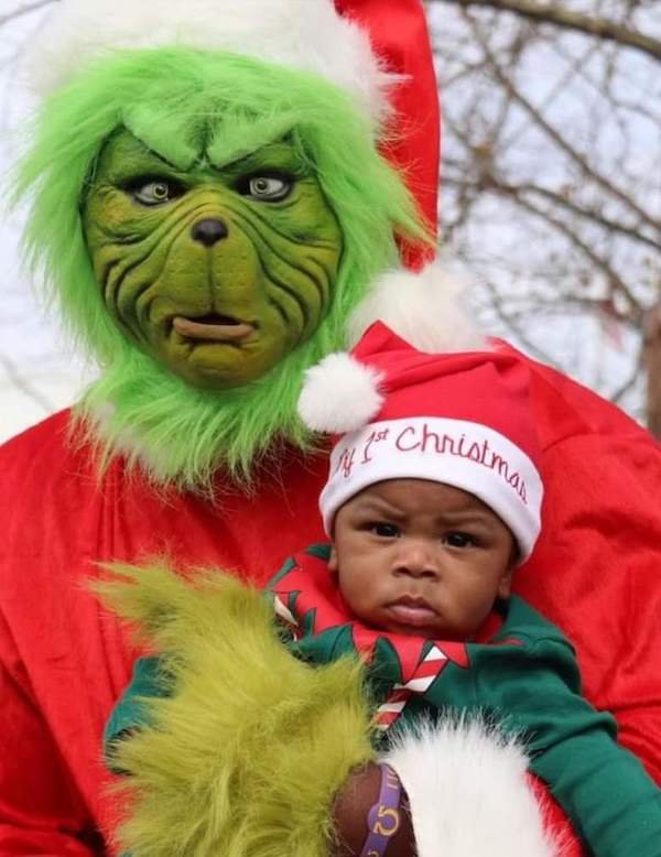 funny pictures - little kid hanging out with christmas grinch