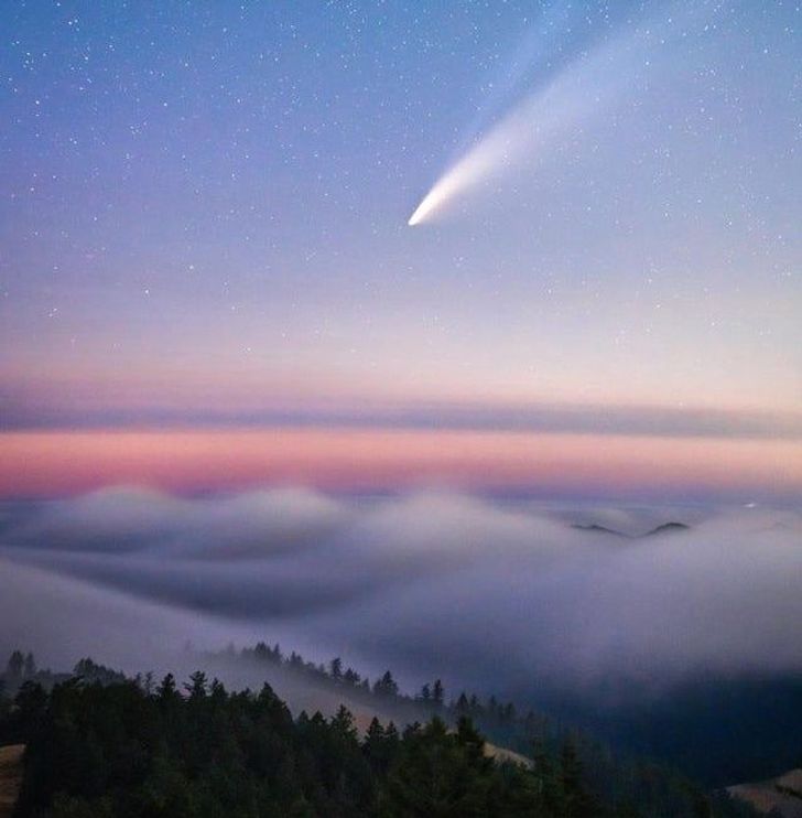 Neowise Comet flying over a fog wave