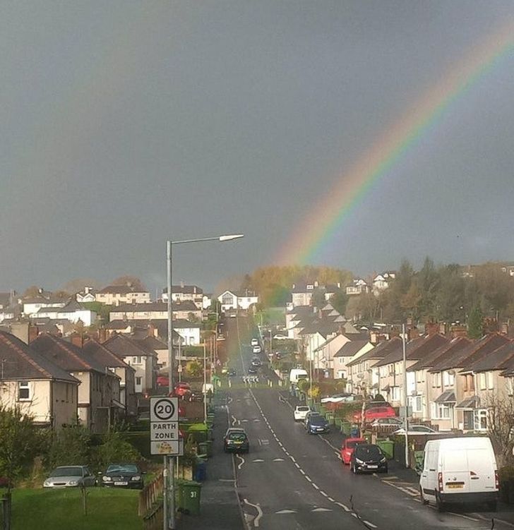 This rainbow appears to be coming from the roundabout up the road.