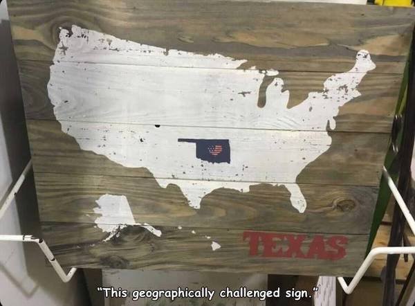 wood - "This geographically challenged sign."