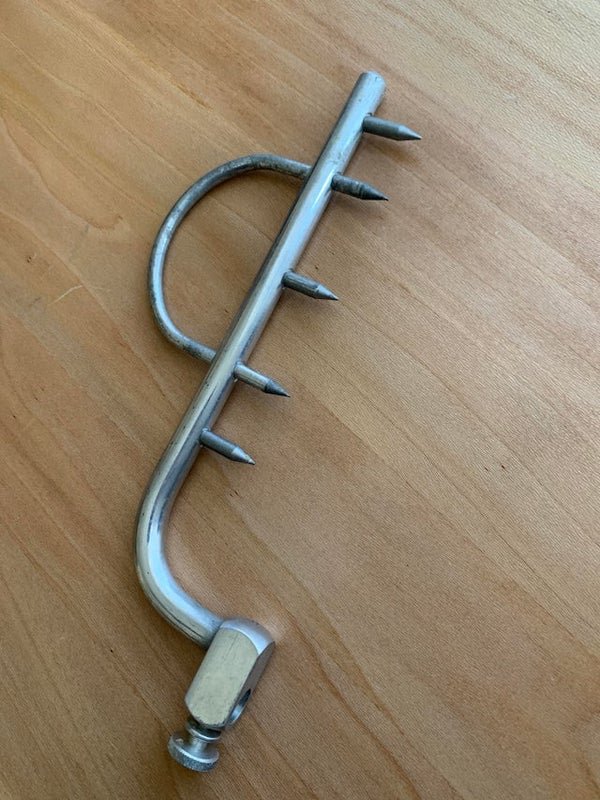 curious objects - spiked metal tool for holding meat