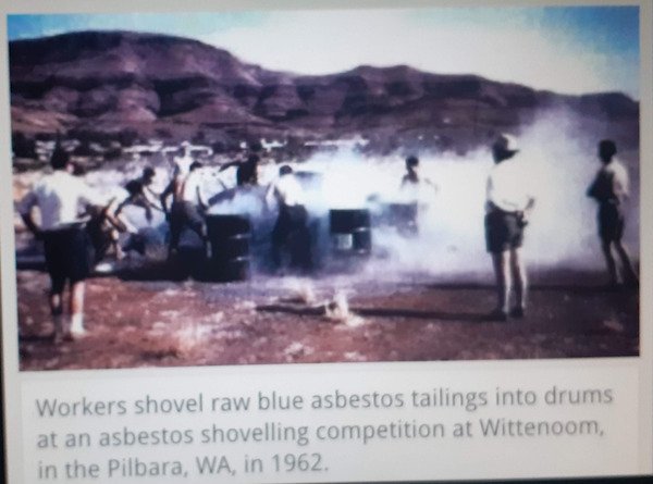 asbestos competition - Workers shovel raw blue asbestos tailings into drums at an asbestos shovelling competition at Wittenoom, in the Pilbara, Wa, in 1962