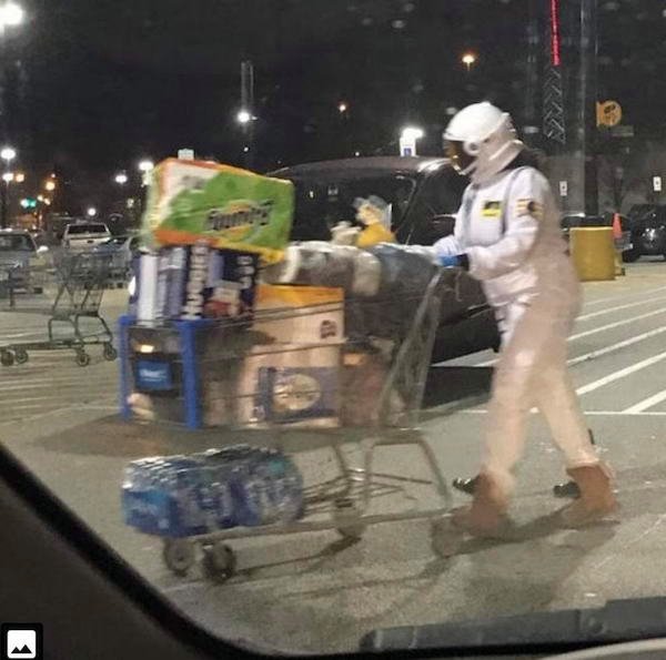 funny pictures and memes - woman dressed in full hazmat suit to buy groceries