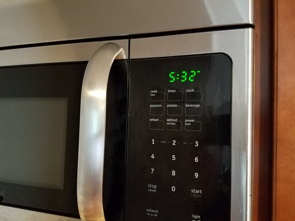 microwave time - " timer cook tie clock popcorn potato beverage reheat defrost power level 1 N Vet 3 4 5 6 7 8 9 stop Cancel 0 start chat M light