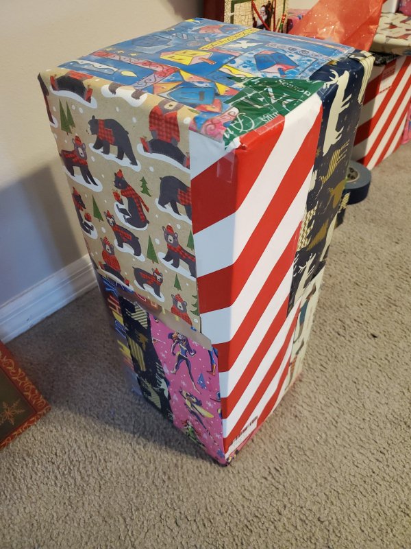 cool pics - christmas present wrapped with scraps of old wrapping paper