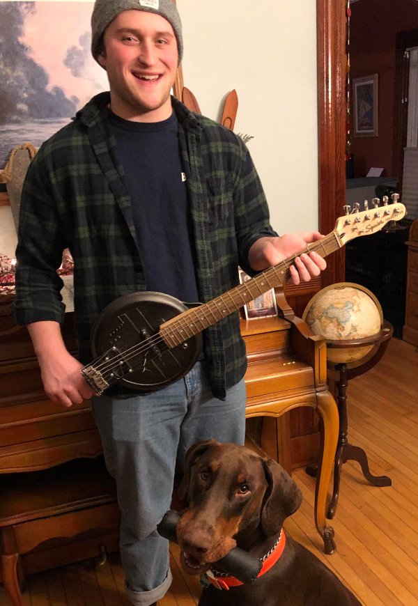 cool pics - guy holding electric guitar made from cast iron pan