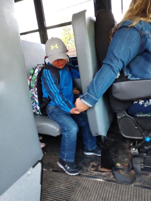 school bus driver holding hand