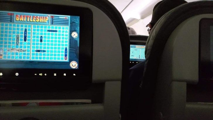cool pics -- people cheating at battleship on an airplane