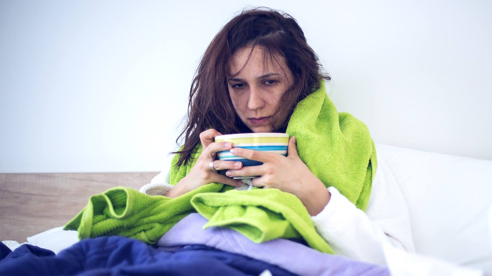 sick person eating soup