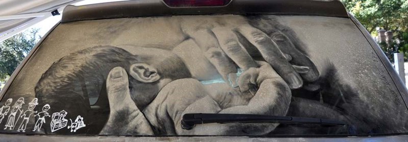 drawing on a dirty car