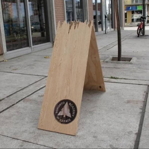 "This Karate Academy's Wooden Advertising Board"