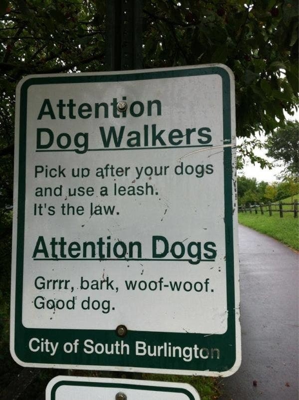 street sign - Attention Dog Walkers Pick up after your dogs and use a leash. It's the law. Attention Dogs Grrrr, bark, woofwoof. Good dog. City of South Burlington