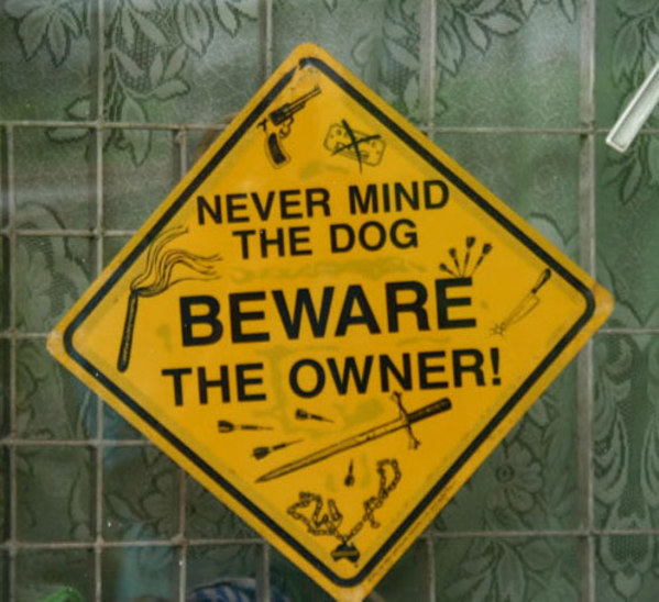 funny sign boards around the world - Never Mind The Dog Beware The Owner!