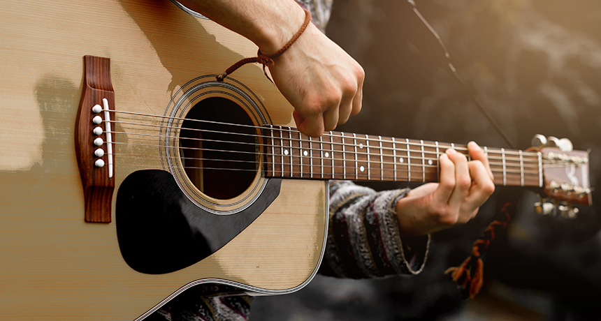 playing acoustic guitar