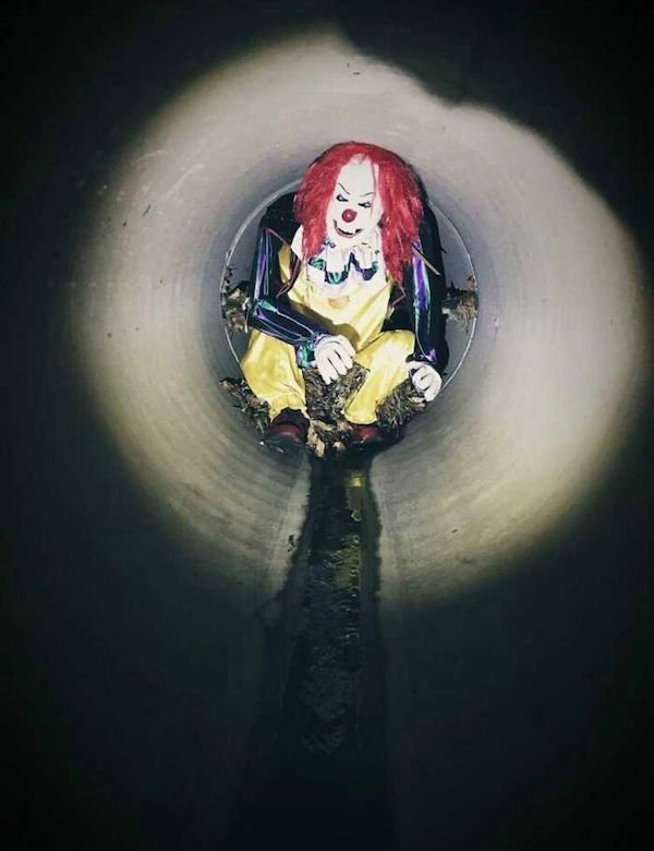 clown in drain pipe -
