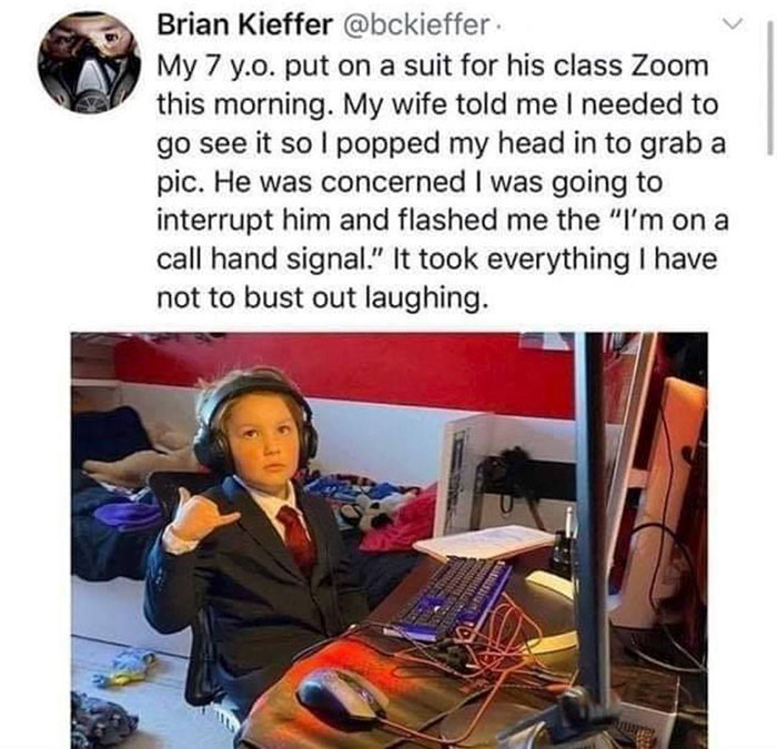 zoom interruptions - Brian Kieffer My 7 y.o. put on a suit for his class Zoom this morning. My wife told me I needed to go see it so I popped my head in to grab a pic. He was concerned I was going to interrupt him and flashed me the "I'm on a call hand si