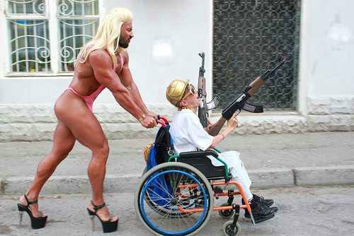muscle man pushing wheelchair