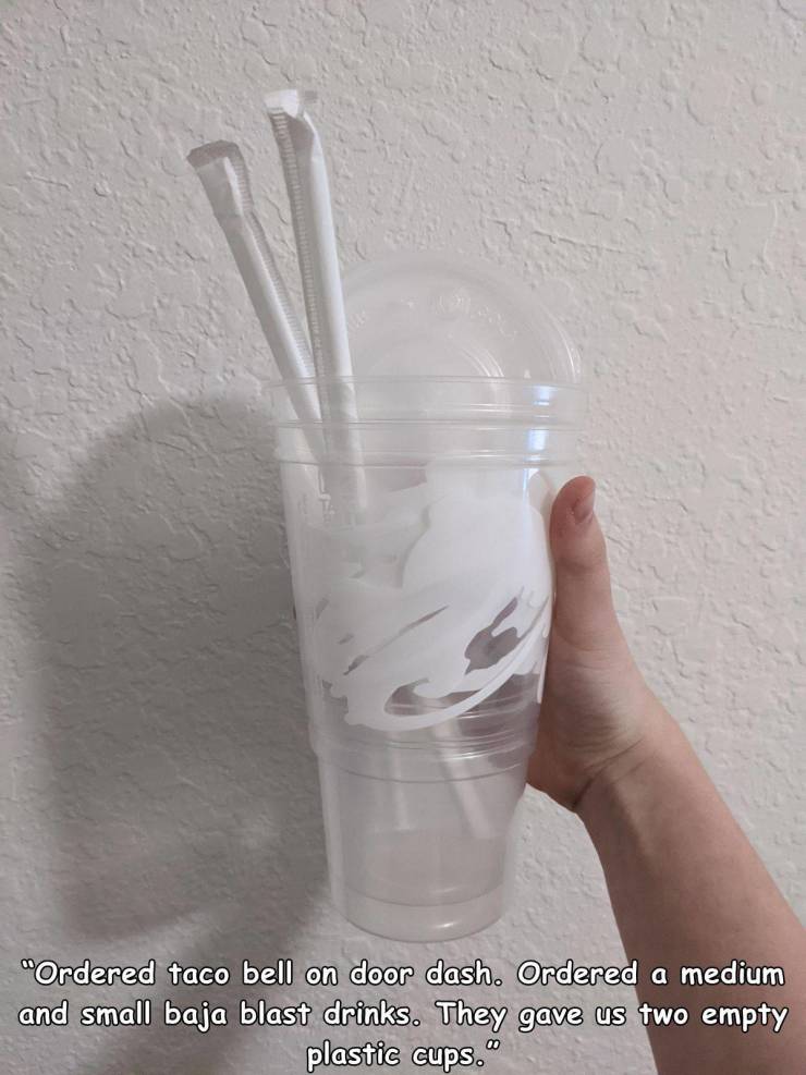 glass - "Ordered taco bell on door dash. Ordered a medium and small baja blast drinks. They gave us two empty plastic cups."