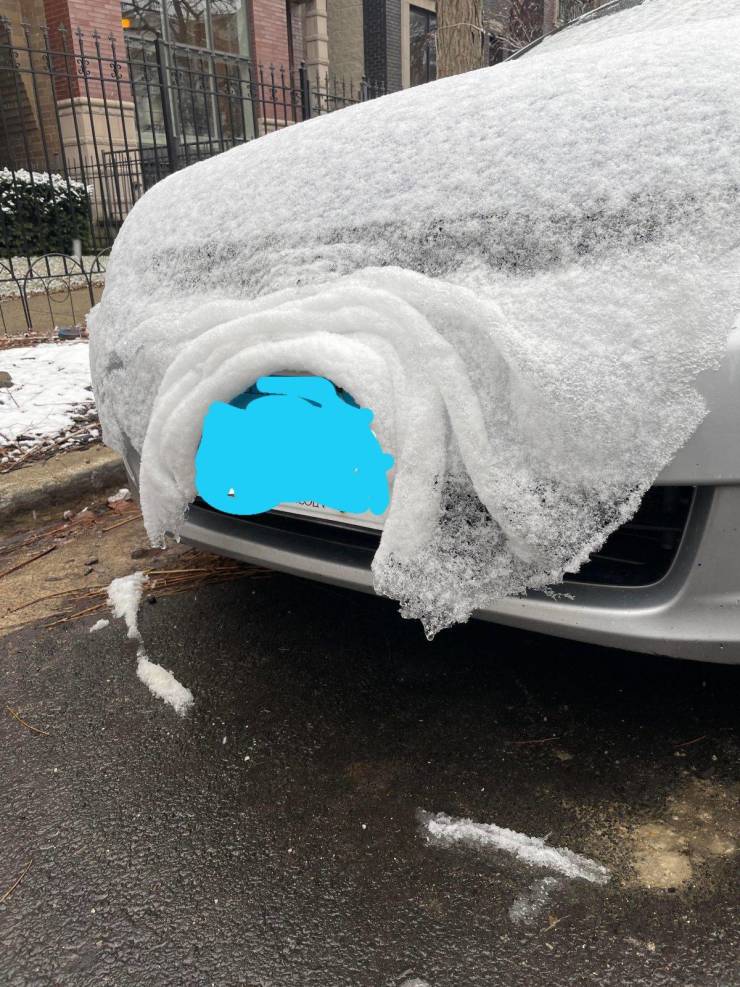 “The way the snow blanketed around this license plate looks so delicate.”