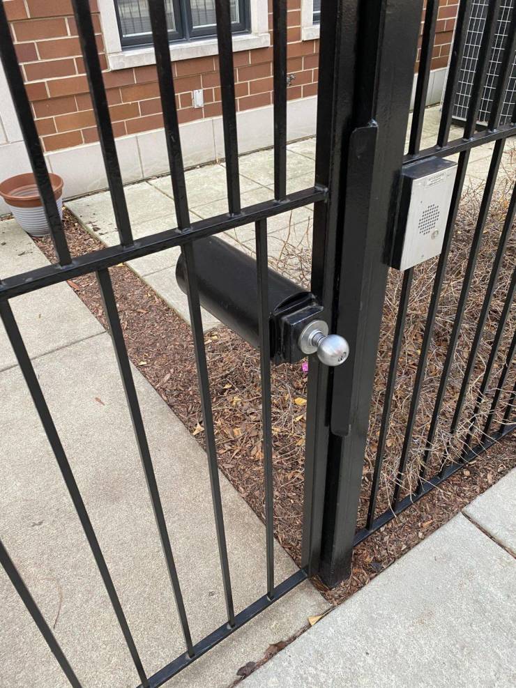 “Doorknob cover on gate prevents people from reaching through and opening.”