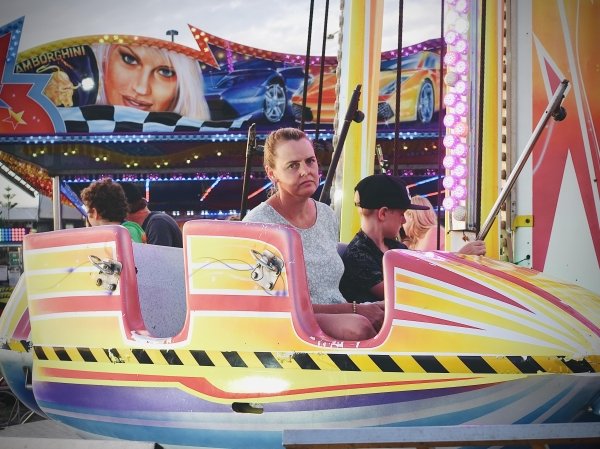 funny memes - mom looking bored on amusement ride