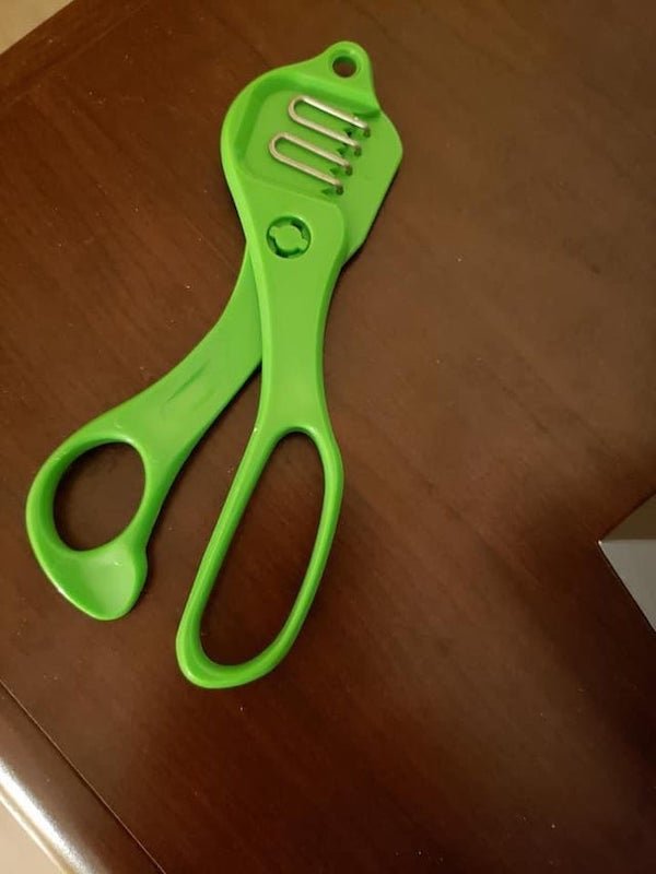 Green plastic scissor handle with metal loops and plastic teeth. No identifying marks.

A: My guess would be some sort of herb stripper. Sprigs go in the loops; teeth are closed, and stalks are pulled out.