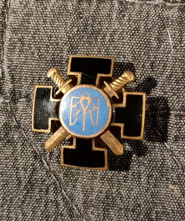 Please help me identify this badge! found while cleaning and have no idea what it is or where it is from. It is small about 5 cent size (pic for reference), it is solid and heavy for how little it is. On the back are the letters CYBB. I tried to search myself with no luck, please help.

A: Definitely Ukrainian state-related badge. Sign in the center — small coat of arms of Ukraine.