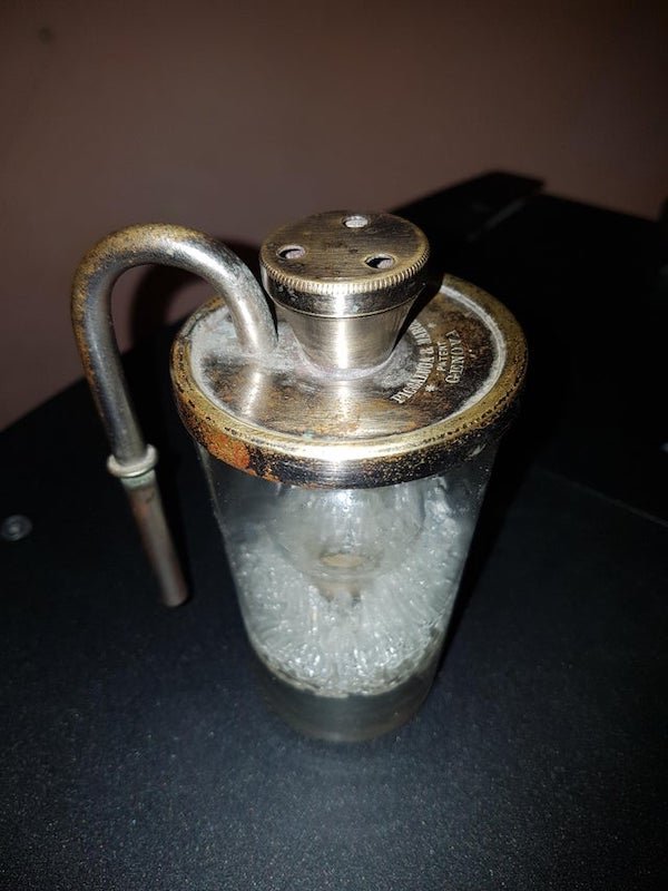 Found in an old house. The balls inside are made of glass.

A: It is described in this document (in Italian) as being for determining the alcohol level in a filter for wine. Apparently it siphons directly from the barrel, at least based on my understanding from the google translation of it.