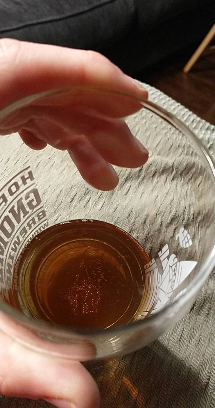 cool pics - bubbles in the shape of a gnome in beer glass