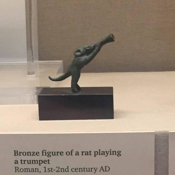cool pics - bronze figure of a rat playing a trumpet