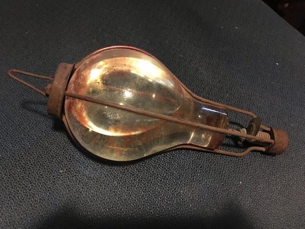 Unknown glass object filled with unknown liquid, found in an early 1900’s barn. Any leads?

A: Fire extinguisher.