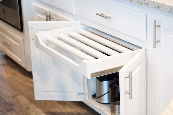 This rack type drawer is mounted in a kitchen cabinet. This is as far as it pulls out and the bars do not rotate or come out.

A: This is to hang washcloths and gloves. My stepmother installs them under her sink, since they don’t come standard.