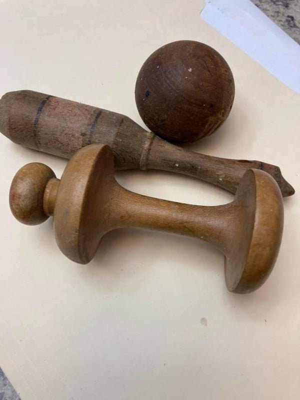 Wooden objects. Ball is roughly baseball sized. Found while cleaning out an old desk

A: Darning ball, glove darner and darning mushroom.