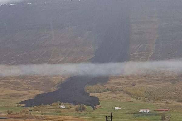 Landslide splits just before hitting a farm in Iceland. Happened this morning. No one got hurt.