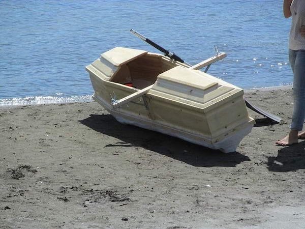 funny pics - coffin boat kayak
